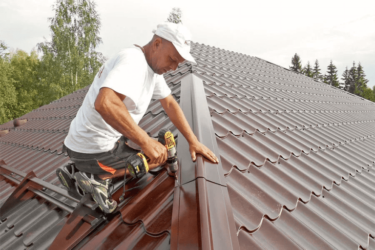 worker fitting a roof